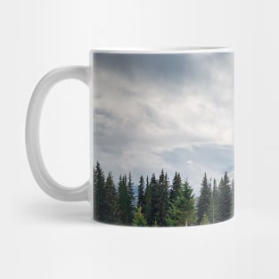 Fir forest on the snowy hills Mug